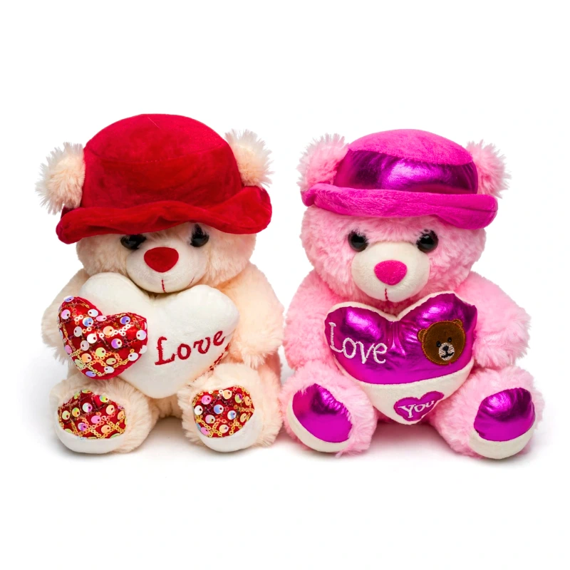 Peluche - osito sentado con sombrero sosteniendo un corazon Altura 25cm